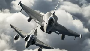 A Royal Air Force Typhoon of 1(F) Squadron (top) and a French Air Force Mirage 2000N practice their formation flying skills during Exercise Capable Eagle, October 2013.
