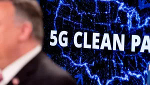 A screen that reads "5G Clean Path" with a map of the United States is visible behind Secretary of State Mike Pompeo as he speaks at a news conference at the State Department, Wednesday, April 29, 2020.