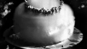 A huge mushroom cloud rises above Bikini atoll in the Marshall Islands following an atomic test blast.