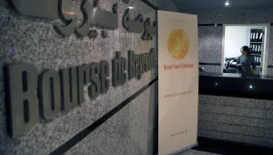 An employee stands at the entrance of the Beirut Stock Exchange in Beirut, Lebanon, Monday, May 6, 2019. The exchange said it is suspending trading due to the open strike declared by the employees of Lebanon's central bank. Hundreds of Lebanese public employees are on strike amid concerns that their salaries and benefits might be cut as the government discusses an austerity budget
