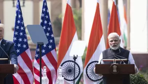 U.S. President Donald Trump stands as Indian Prime Minister Narendra Modi speaks a news conference at Hyderabad House, Tuesday, Feb. 25, 2020, in New Delhi, India. 