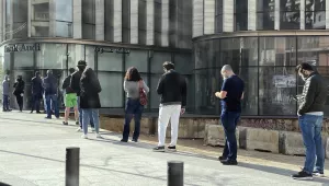 People stand in a line outside a bank in Beirut, Lebanon, amid a financial crisis and a lockdown imposed by the government to help stem the spread of the coronavirus in Lebanon, March 28, 2020.