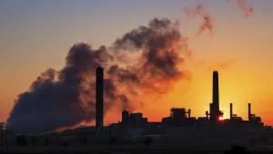 The Dave Johnston coal-fired power plant is silhouetted against the morning sun in Glenrock, Wyoming, July 27, 2018.