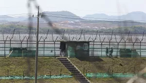 South Korean army soldiers patrol along the barbed-wire fence in Paju, South Korea, near the border with North Korea, Sunday, May 2, 2021.