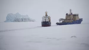 Russian icebreaker makes a path for a cargo ship