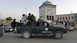 Taliban fighters patrol inside the city of Kandahar, southwest Afghanistan, Sunday, Aug. 15, 2021.