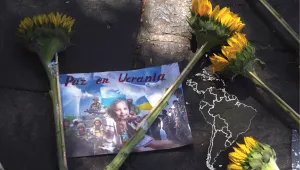 Sunflowers lay over an image with the Spanish message: "Peace in Ukraine" outside the Russian embassy after demonstrators protested Russia's invasion of Ukraine in Mexico City, March 24, 2022.