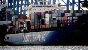 A container ship of Chinese Cosco shipping lies in the harbor in Hamburg, Germany, Wednesday, Oct. 26, 2022