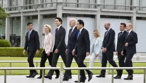 From left, British Prime Minister Rishi Sunak, European Commission President Ursula von der Leyen, Canadian Prime Minister Justin Trudeau, U.S. President Joe Biden, Japan's Prime Minister Fumio Kishida, Italian Premier Giorgia Meloni, European Council President Charles Michel, French President Emmanuel Macron and German Chancellor Olaf Scholz walk to get into place to participate in a wreath laying ceremony at the Peace Memorial Park as part of the G7 Hiroshima Summit in Hiroshima, May 19, 2023. 