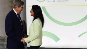 U.S. Climate Envoy John Kerry, left, is welcomed by French Secretary of State for Development, Francophonie and International Partnerships Chrysoula Zacharopoulou at the New Global Financial summit in Paris, June 22, 2023. The aim of a two-day climate and finance summit in Paris that ends Friday, June 23, was to set up concrete measures to help poor and developing countries better tackle issues like poverty and climate change.