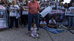 Relatives of people kidnapped by Hamas militants hold the pictures of their loved ones during a protest calling for their return, in Tel Aviv, Israel, Thursday, Oct. 26, 2023. On Oct. 7, more than 1,400 people were killed and over 220 captured in an unprecedented, multi-front attack by the militant group that rules Gaza. 