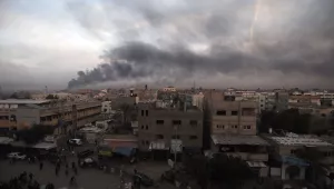 Smoke rises from town of Khan Younis after Israeli strikes on Sunday, Dec. 10, 2023.