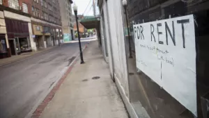 a "For Rent" sign is taped to a storefront window in the coal town of Welch, W.Va