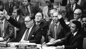 Ambassador Ivor Richard, left, of the United Kingdom, and U.S. Ambassador Andrew Young, right, raise their arms during vote, Friday, Nov. 4, 1977 at the United Nations Security Council. 