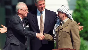 President Bill Clinton with with Israeli Prime Minister Yitzhak Rabin, left, and Palestinian leader Yasser Arafat, right, in Washington Sept. 13, 1993, marking the signing of the peace accord between Israel and the Palestinians. 