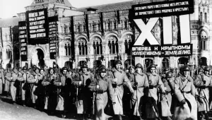 Soldiers of the Soviet Red Army are marching in a parade at Moscow's Red Square, in this undated photograph. In the background the "GUM," the largest department store in Moscow, is decorated with huge banners of government propaganda. (AP Photo)