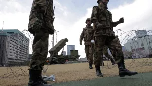 Japan's Self-Defense Force personnel stand by a PAC-3 Patriot missile unit, deployed in Tokyo on Saturday, April 7, 2012, in preparation for North Korea's rocket launch. (AP Photo/Itsuo Inouye)