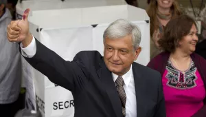 Mexican presidential candidate Andres Manuel Lopez Obrador of the Democratic Revolution Party shows his election ink-stained thumb after casting his vote at a polling station in Mexico City on Sunday, July 1, 2012.