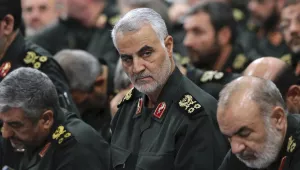 In this Sept. 18, 2016 photo released by an official website of the office of the Iranian supreme leader, Revolutionary Guard Gen. Qassem Soleimani, center, attends a meeting with Supreme Leader Ayatollah Ali Khamenei and Revolutionary Guard commanders in Tehran, Iran. 