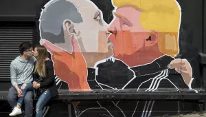 Graffiti depicting Russian President Vladimir Putin, left, and U.S. President Donald Trump, on the walls of a bar in the old town in Vilnius, Lithuania on Saturday, May 4th, 2016. (AP Photo/Mindaugas Kulbis, File)