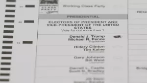 In this Dec. 5, 2016, file photo, a ballot with a vote for Donald J. Trump is shown during a statewide presidential election recount in Waterford Township, Mich. Recounts of the presidential vote in three states highlight major vulnerabilities in the U.S. election system. (AP Photo/Paul Sancya, File)