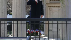 President Donald Trump salutes after laying a wreath at the Hermitage, the home of President Andrew Jackson, to commemorate Jackson's 250th birthday, Wednesday, March 15, 2017, in Nashville, Tenn. (AP Photo/Evan Vucci)