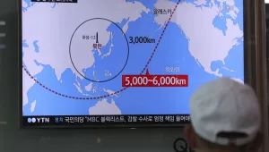 A man watches a TV screen showing a local news program reporting on North Korea's missiles at the Seoul Train Station in Seoul, South Korea, Wednesday, Aug. 9, 2017. Donald Trump’s threat to unleash “fire and fury” on North Korea might have been written by Pyongyang’s propaganda mavens, so perfectly does it fit the North’s cherished claim that it is a victim of American aggression (AP Photo/Lee Jin-man).