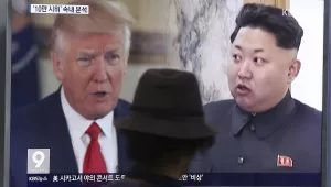 In this Thursday, Aug. 10, 2017, file photo, a man watches a television screen showing U.S. President Donald Trump, left, and North Korean leader Kim Jong Un during a news program at the Seoul Train Station in Seoul, South Korea. North Korea has announced a detailed plan to launch a salvo of ballistic missiles toward the U.S. Pacific territory of Guam, a major military hub and home to U.S. bombers. If carried out, it would be the North's most provocative missile launch to date. (AP Photo/Ahn Young-joon, Fil