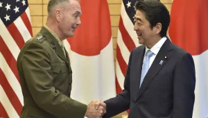 Chairman of the Joint Chiefs of Staff Joseph Dunford, left, shakes hands with Japanese Prime Minister Shinzo Abe prior to a meeting at Abe's official residence in Tokyo on Friday, Aug. 18, 2017. (Kazuhiro Nogi/Pool Photo via AP)