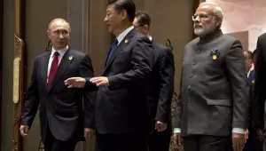 From left, Russian President Vladimir Putin, Chinese President Xi Jinping and Indian Prime Minister Narendra Modi arrive for the Dialogue of Emerging Market and Developing Countries in southeastern China on Tuesday, Sept. 5, 2017. (AP Photo/Mark Schiefelbein, Pool)