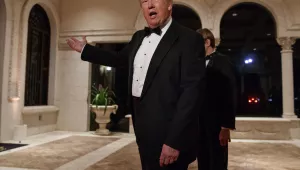 President Donald Trump speaks with reporters as he arrives at a New Year's Eve gala in his Mar-a-Lago resort, Palm Beach, on Sunday, Dec. 31, 2017. (AP Photo/Evan Vucci, File)