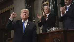 President Donald Trump gestures as he finishes his first State of the Union address in the House chamber of the U.S. Capitol to a joint session of Congress January 30, 2018 in Washington, as Vice President Mike Pence and House Speaker Paul Ryan applaud. (Win McNamee/Pool via AP)
