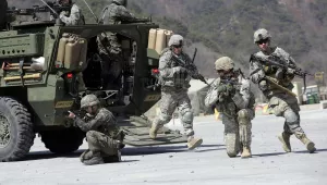 In this March 25, 2015, file photo, U.S. Army soldiers from the 25th Infantry Division's 2nd Stryker Brigade Combat Team and South Korean soldiers take their position during a demonstration of the combined arms live-fire exercise as a part of the annual joint military exercise Foal Eagle between South Korea and the United States at the Rodriquez Multi-Purpose Range Complex in Pocheon, north of Seoul, South Korea. (AP Photo/Lee Jin-man, File)