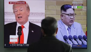 In this March 27, 2018 file photo, A man watches a TV screen showing file footages of U.S. President Donald Trump, left, and North Korean leader Kim Jong Un, right, during a news program at the Seoul Railway Station in Seoul, South Korea. (AP Photo/Lee Jin-man, File)