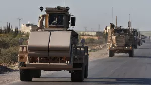 An armored vehicle goes patrolling for mines with a U.S. military convoy in Northern Syria, March 31, 2018.