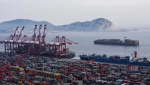 Photo of a container ship docked in Shangahi.
