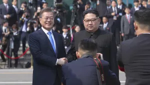 North Korean leader Kim Jong Un, right, poses with South Korean President Moon Jae-in for a photo at the border village of Panmunjom in the Demilitarized Zone. April 27, 2018 (Korea Summit Press Pool via AP).