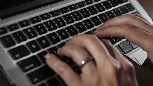 A person begins to type on a laptop keyboard in North Andover, MA, June 19, 2017.