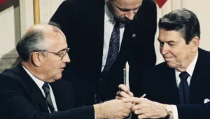 In this Dec. 8, 1987 file photo U.S. President Ronald Reagan, right, and Soviet leader Mikhail Gorbachev exchange pens during the Intermediate Range Nuclear Forces Treaty signing ceremony in the White House East Room in Washington, D.C. (AP Photo/Bob Daugherty).