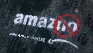 Graffiti painted on the sidewalk that reads "amazno" by someone opposed to the location of the Amazon headquarters in New York