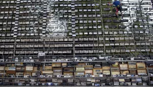 A technician prepares a giant construction made up of nearly 1,500 old radios on Vilnius Cathedral square, to commemorate events of 1989 when analog radios were used to coordinate the so-called Baltic Way human chain, in Vilnius, Lithuania, Friday, Aug. 23, 2019.