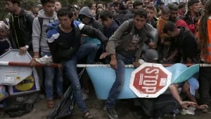 Photo of migrants skipping over varrier between Servia and Croatia, 2015. 