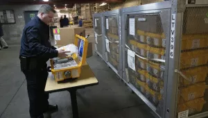Vincent Dellova, a coordinator at the New York City Emergency Management Warehouse, packs up a ventilator, part of a shipment of 400, that arrived Tuesday, March 24, 2020 in New York. (AP Photo/Mark Lennihan)