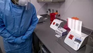 Dr. Justin Jacob runs a sample COVID-19 test inside a mobile testing lab unit that will begin testing in response to the Coronavirus outbreak, Tuesday, April 28, 2020, in Washington.