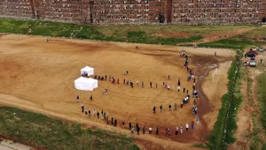 Residents from the Alexandra township in Johannesburg gather in a stadium to be tested for COVID-19 Wednesday, April 29, 2020.