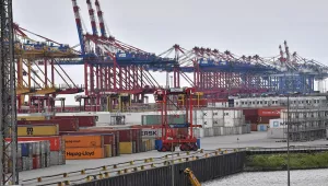 In this Thursday, May 16, 2019 file photo, containers are stored in the free harbor in Bremerhaven, Germany.
