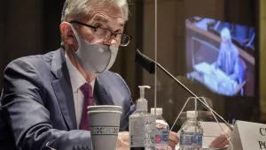 Federal Reserve Board Chairman Jerome Powell, reflected in the sneeze guard set up between himself and members of the House Committee on Financial Services, speaks during a hearing on oversight of the Treasury Department and Federal Reserve pandemic response, Tuesday, June 30, 2020 on Capitol Hill in Washington. 