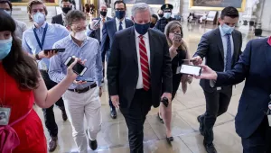 Treasury Secretary Steven Mnuchin, center left, and President Donald Trump's Chief of Staff Mark Meadows, center right, walk out of a meeting with House Speaker Nancy Pelosi of Calif., and Senate Minority Leader Sen. Chuck Schumer of N.Y., on Capitol Hill in Washington, Wednesday, July 29, 2020, after lawmakers were unable to reach a deal on a new coronavirus relief package.