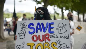 Theatre workers protest outside the National Theatre, against the mass redundancies of low-paid art jobs due to the Coronavirus outbreak, in London, Saturday, Aug. 1, 2020.
