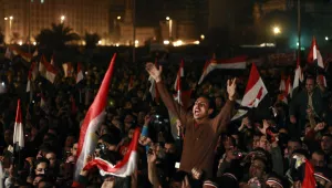 Egyptians celebrate the news of the resignation of President Hosni Mubarak, Feb. 11, 2011. (AP Photo/Ben Curtis)